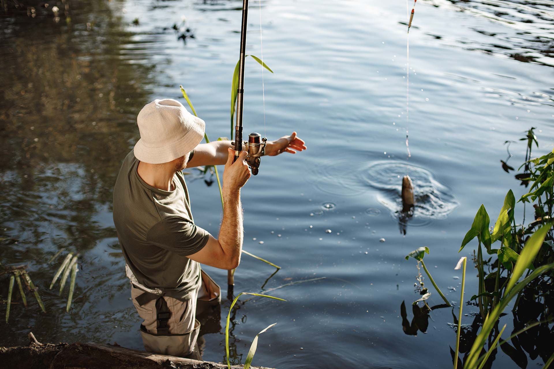 young-fisherman-with-fishing-rod-near-the-lake-at-2024-04-08-17-38-04-utc.jpg